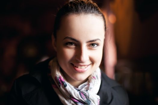  Portrait of natural beauty young woman over dark background. Closeup on face, shallow DOF.
