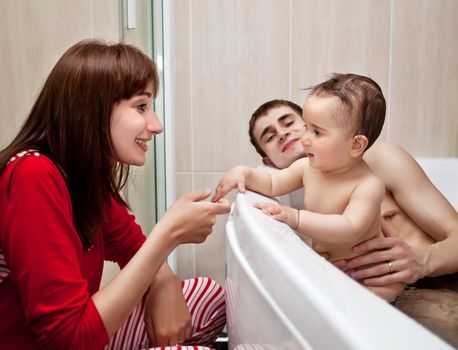 Family and baby in a bathroom