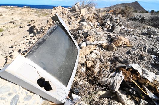 A Broken Gray Television Abandoned in the Desert