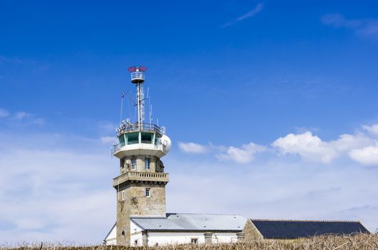 Old stone lighthouse with modern equipment, Cape Ra, (Pointe du Raz), westernmost France point
