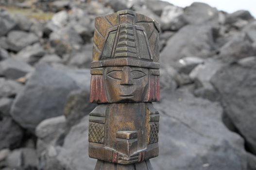 Ancient Maya Statue on the Rocks near the Ocean