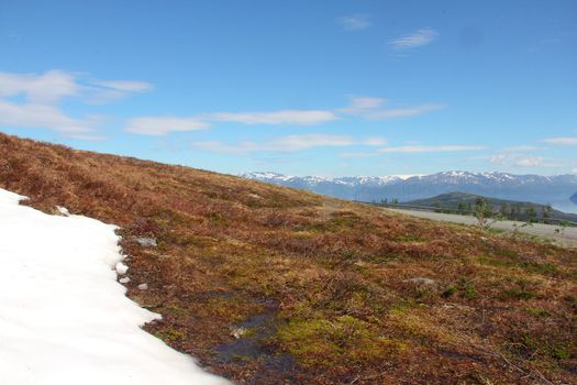 View from glacier on road and mountains in  northern Norway