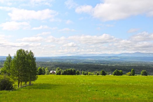 Landscape with mountains and scandinavian village at summer