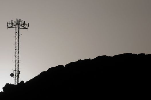 Some Silhouetted Antennas on the top of a Hill