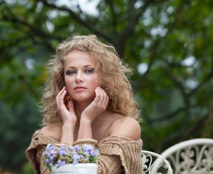 young beautiful woman is resting in the garden