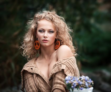 young beautiful woman is resting in the garden