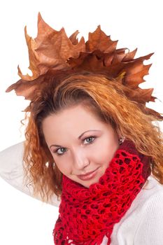 Redhead girl with dry autumn leaves