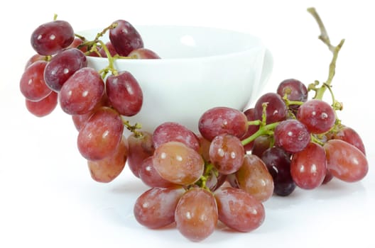 ripe fruits in white bowl ( grape) over white background