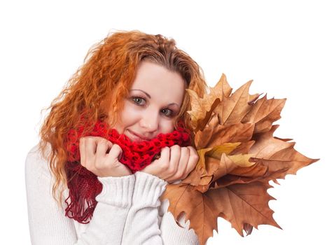 Redhead girl with yellow autumn leaves