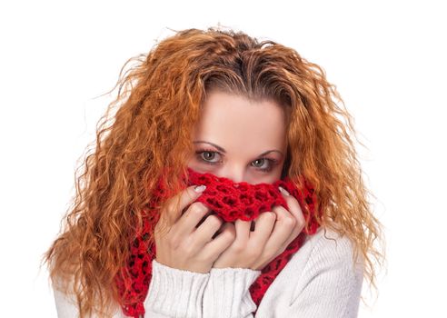 red-haired girl covers her face with red scarf isolated on white 