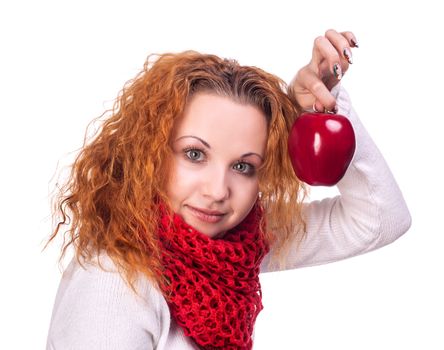 Red-haired girl with apple isolated on white