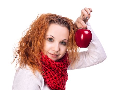 Red-haired girl with apple isolated on white