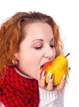 Red-haired girl want to eat a pears isolated on white