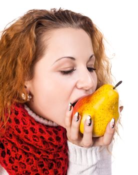 Red-haired girl want to eat a pears isolated on white