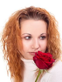 Portrait of young beautiful woman with red rose