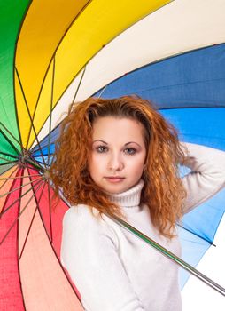 Young red-haired woman with a color umbrella