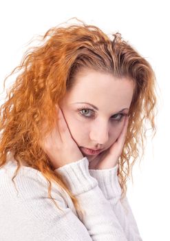 Thoughtful young woman on a white background