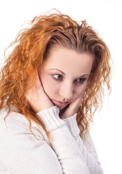 Thoughtful young woman on a white background