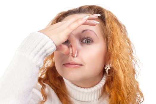 young woman holding her nose because of a bad smell