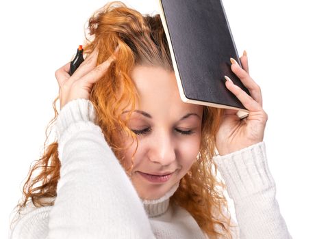 Education. Tired girl holds a notebook on her head on a white background