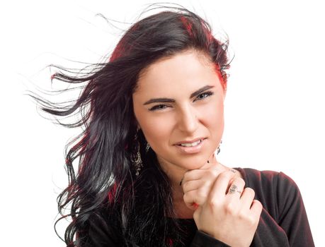 Portrait of a beautiful young woman with hair flying in white background