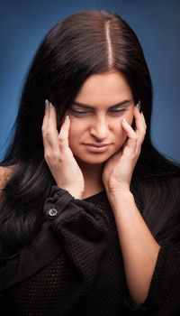 Unhappy young woman with bad headache