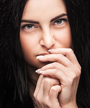 Pretty young brunette looking thoughtfully