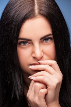 Pretty young brunette looking thoughtfully