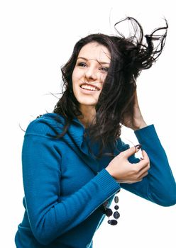 Portrait of a beautiful young woman with hair flying
