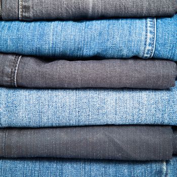 Stack of blue and black Jeans