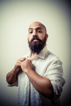 long beard and mustache man with white shirt on gray background