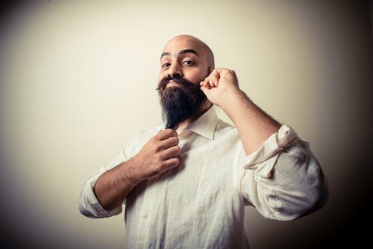 long beard and mustache man with white shirt on gray background