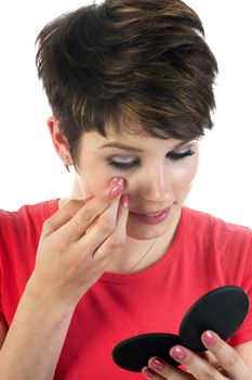 Closeup of a woman inserting a contact lens in her eye