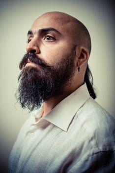 long beard and mustache man with white shirt on gray background