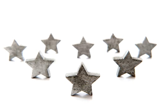 silver stars for christmas in a row on a white background