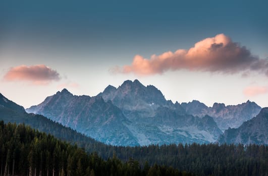 Pink cloud over the mountains in High Tatras National Park.. Strbske pleso, Slovakia, Europe