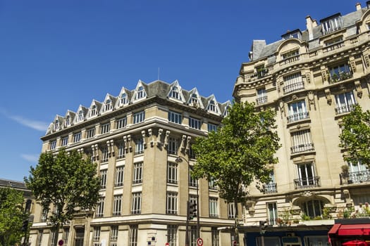 Facade of a traditional living building in Paris, France