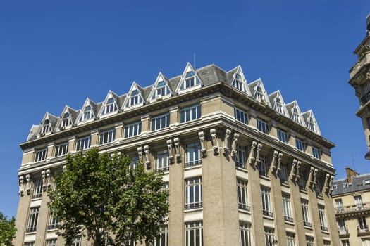 Facade of a traditional living building in Paris, France