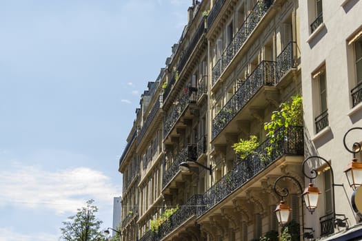 Facade of a traditional living building in Paris, France