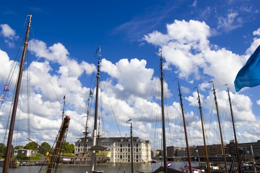 many ships parked near the shore in Amsterdam