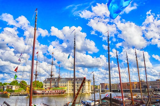 many ships parked near the shore in Amsterdam