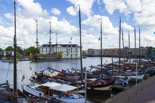 many ships parked near the shore in Amsterdam