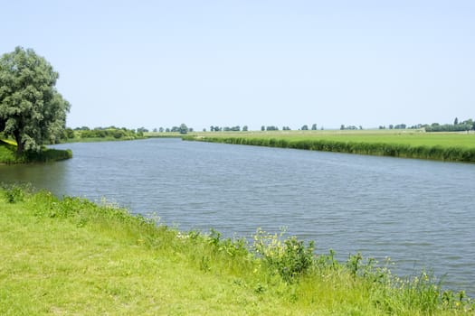 Rural dutch landscape with a river