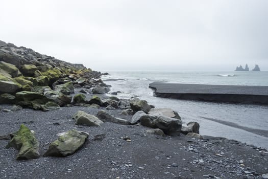 mountain river flows into the ocean, Iceland