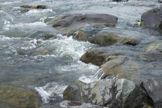 Close-up photo of transparent mountain stream, Iceland