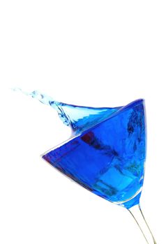Blue cocktail drink splash over a white background
