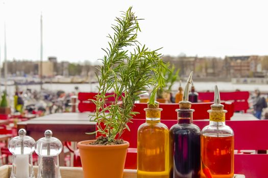 balsamic vinegar bottles and condiments on the table in an open cafe