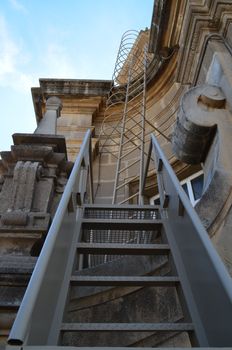 Roof top fire escape attached to the side of a museum in Barcelona,Spain.