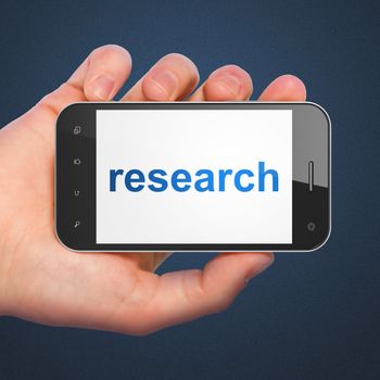 Marketing concept: hand holding smartphone with word Research on display. Generic mobile smart phone in hand on Dark Blue background.