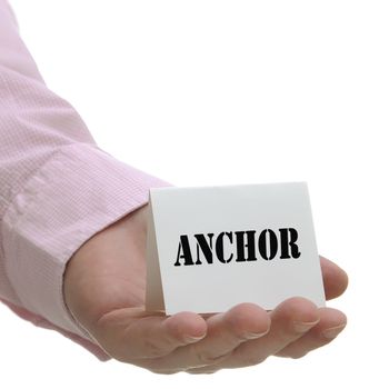 Business man holding anchor sign